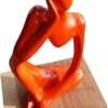 Aesthetics Conscious Orange Color Ceramic Thinker Statue with Wooden Stand